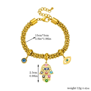 Gold Hamsa Hand and Evil Eye charm bracelet with measurements on white background