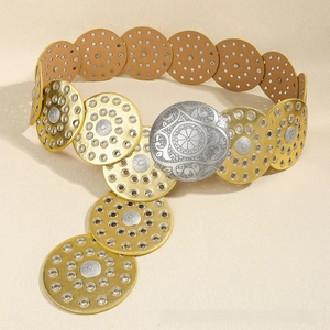 Detailed view of bohemian belt featuring silver embossed floral buckle and hollow round discs