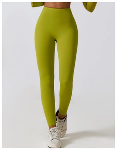 Lower body shot of high waisted quick-dry yoga leggings in lime green athletic wear