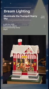 Detailed Santa's Workshop musical box with miniature figurines and glowing snowy roof