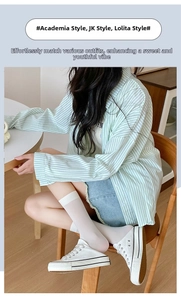 Thin white velvet high socks paired with casual denim shorts for a college style look