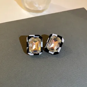 Checkerboard crystal earrings with silver needles and geometric square rhinestone design