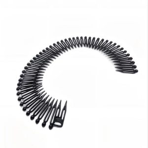 Close-up of black plastic zigzag hair comb headband with adjustable buckle and dense teeth