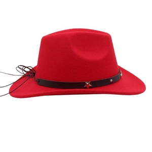 Close-up of red felt cowboy hat featuring black leather band and metal star studs