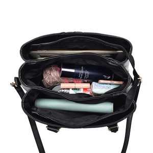 Large capacity black leather handbag with three compartments and spacious interior for women