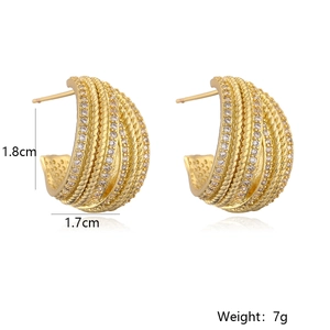 Detail view of 18K gold plated C-shaped geometric earrings with white cubic zirconia