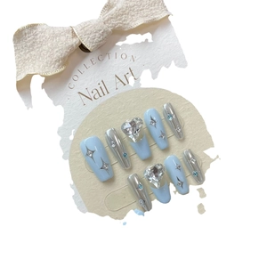 Handmade light blue matte coffin press-on nails with silver stars and heart rhinestones