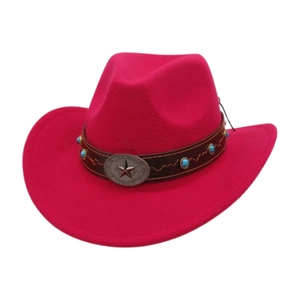 Close-up of hot pink felt cowboy hat with turquoise studs and silver star buckle strap