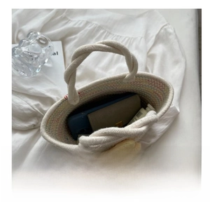 Capacity display of white woven cotton bag showing space for phone and essentials