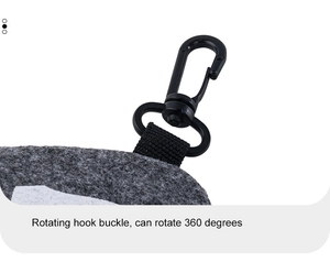 Detail of 360 degree rotating black plastic hook buckle on a grey felt strap connector