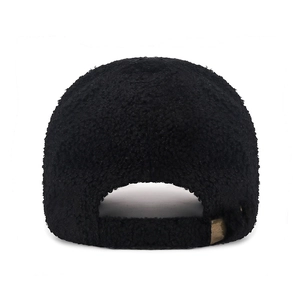 Rear view of black sherpa fleece baseball cap with adjustable antique brass metal buckle