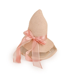 Detail of pink pointed straw hat featuring a large ribbon bow and translucent mesh brim