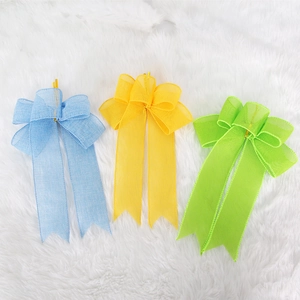 Three-color faux linen Easter bows in blue, yellow, and green for party decorations