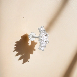 Macro detail of S925 sterling silver stud showing marquise cut zircons and hallmark