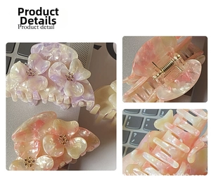 Detail of floral hair claw clip featuring gradient petals and iridescent pearly finish
