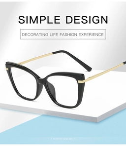 Close-up of vintage cat-eye glasses with TR90 frame and metal temples on a display stand