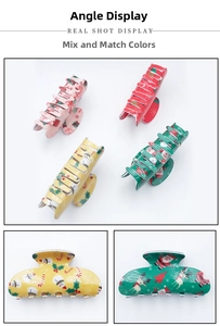 Detail view of festive PVC Christmas hair claws with reindeer and snowman patterns