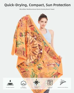 Detail of microfiber beach towel showing quick-dry fabric with floral sun mandala pattern