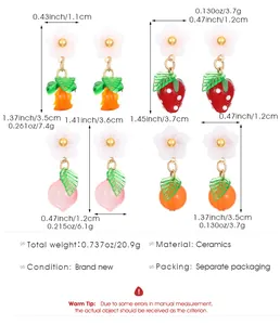 Detailed size chart for ceramic fruit earrings featuring strawberry, peach and orange motifs