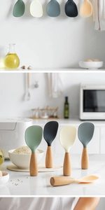 Detail of colorful standing silicone rice paddles with non-stick texture and wooden handles