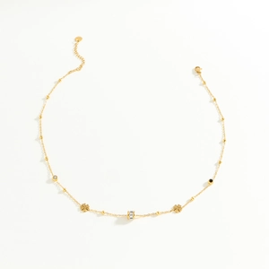Collier élégant en acier inoxydable doré avec trèfle et cylindre serti de diamants