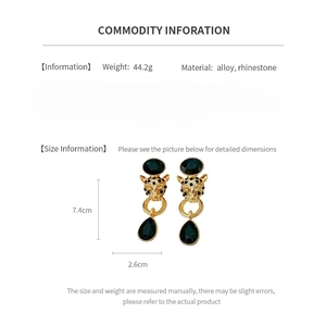 Detailed size and material specs for gold tiger head earrings with crystal rhinestones
