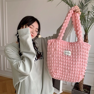 Detail of pink popcorn textured tote bag with LOVE SOZAKKA woven label on soft fabric