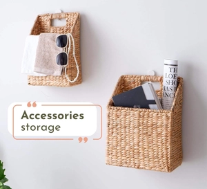 Detailed view of woven wall storage basket holding accessories with natural seagrass texture