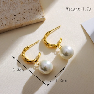 Detailed close-up of gold twist hoop earrings with white pearls and size dimensions