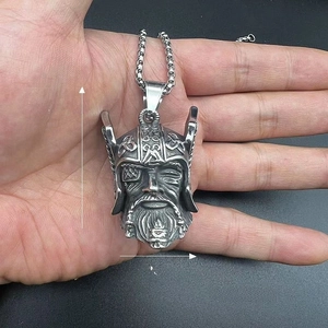 Macro detail of Viking Odin bell pendant in vintage silver with 56mm x 28mm dimensions
