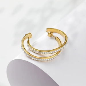 Elegant gold plated C-shaped hoop earrings featuring sparkling pave-set round crystals