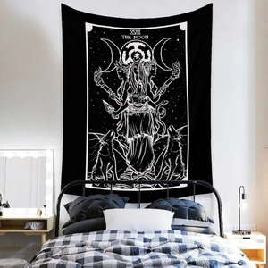 Detail of The Moon tarot tapestry with triple goddess symbols over a dark metal bed frame