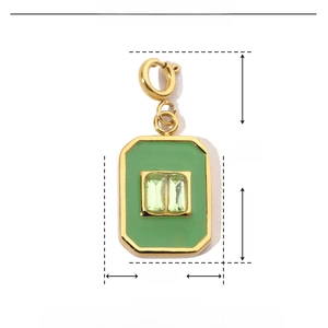 Macro shot of green enamel heart pendant with dimension labels of 24mm by 10mm