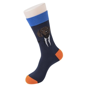 Detail of creative blue crew socks with cartoon dog in suit and orange heel contrast