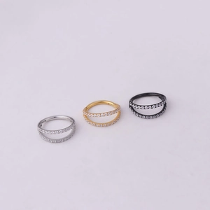 Double row cubic zirconia seamless clicker ring set in silver, gold, and black stainless steel