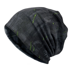 Black distressed knit beanie with neon green slashed embroidery in street fashion style