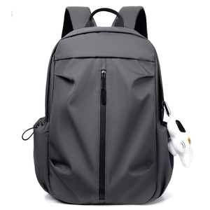Minimalist dark grey sports backpack with vertical zip pocket and plush doll charm