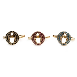 Detailed view of three gold Hamsa rings with black, red and turquoise zircon accents