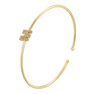 Detail of gold-plated open bracelet featuring a micro-paved zircon letter M motif