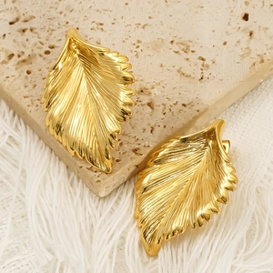 Elegant gold leaf-shaped titanium steel stud earrings with detailed vein texture