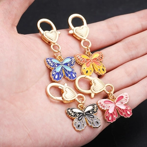 Set of four colorful enamel butterfly keychains with heart shaped metal lobster clasps