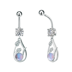 Detail view of silver zircon navel ring featuring leaf design and opal stone inlay