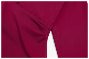 Macro shot of the pleated texture and burgundy knitted fabric on the yoga set garment