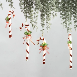 30cm red and white Christmas candy cane ornaments with bows hanging on pine branches