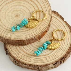 Bohemian gold hoop earrings featuring turquoise chips and engraved fan-shaped charms