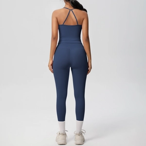 Close-up back view of dark blue high-waist yoga set with criss-cross back sports bra