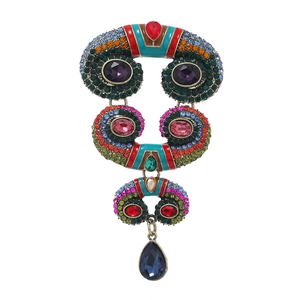 Vintage boho horn brooch with colorful rhinestones and teardrop pendant on white background
