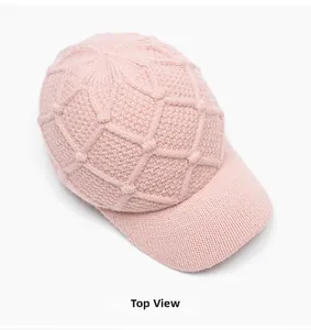 Top view of pink knit baseball cap showing thick diamond weave texture and pattern