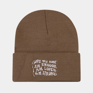 Detailed embroidery of positive quotes on a coffee brown knitted beanie cuff