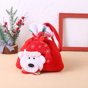 Christmas gift bag with white polar bear plush, red drawstring design for holiday candy